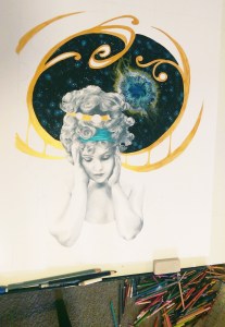 Adding the art nouveau detailing by filling in the pencil outline with metallic gold acrylic.